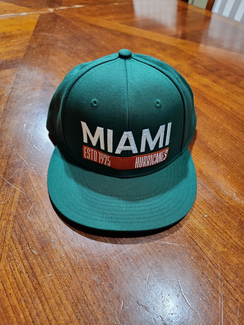 New Era Miami Hurricanes Green Snapback Hat with White & Orange Logo